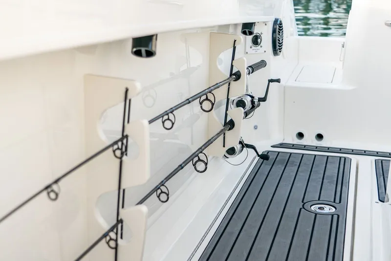 Slide: The Image of Fishing rod holders on a 2025 Trophy T24 CC boat. - 13
