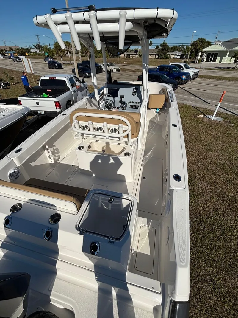 Slide: The Image of 2025 Trophy T24 CC boat with helm and seating area. - 14