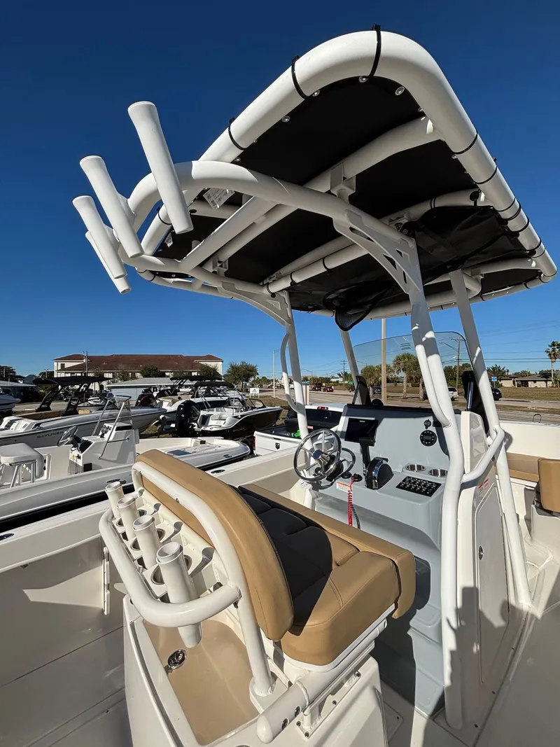 Slide: The Image of 2025 Trophy T24 CC boat with helm and fishing rod holders. - 18
