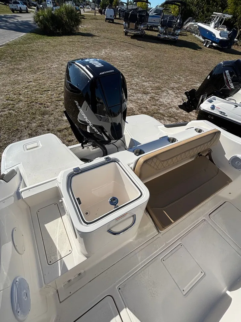 Slide: The Image of 2025 Trophy T24 CC boat with outboard motor and storage. - 8