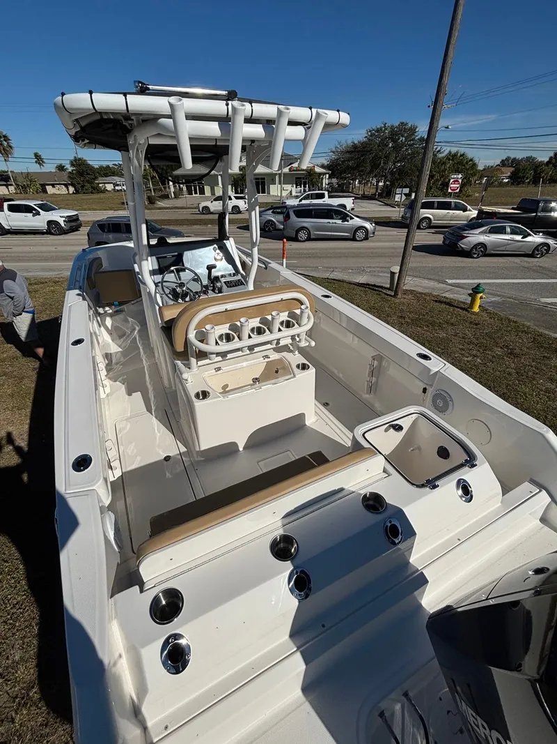 Slide: The Image of 2025 Trophy T24 CC boat with modern features and helm console. - 9