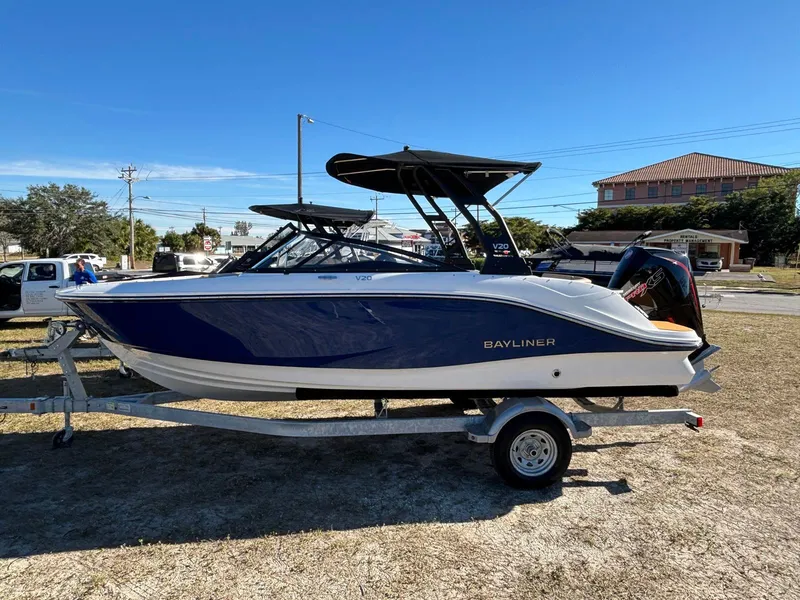 The Image of 2025 Bayliner V20 boat on trailer outdoors. - 1