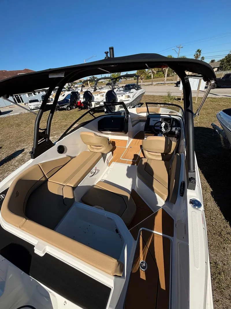 Slide: The Image of Interior view of Bayliner V20 boat, 2025 model, featuring beige seating. - 3