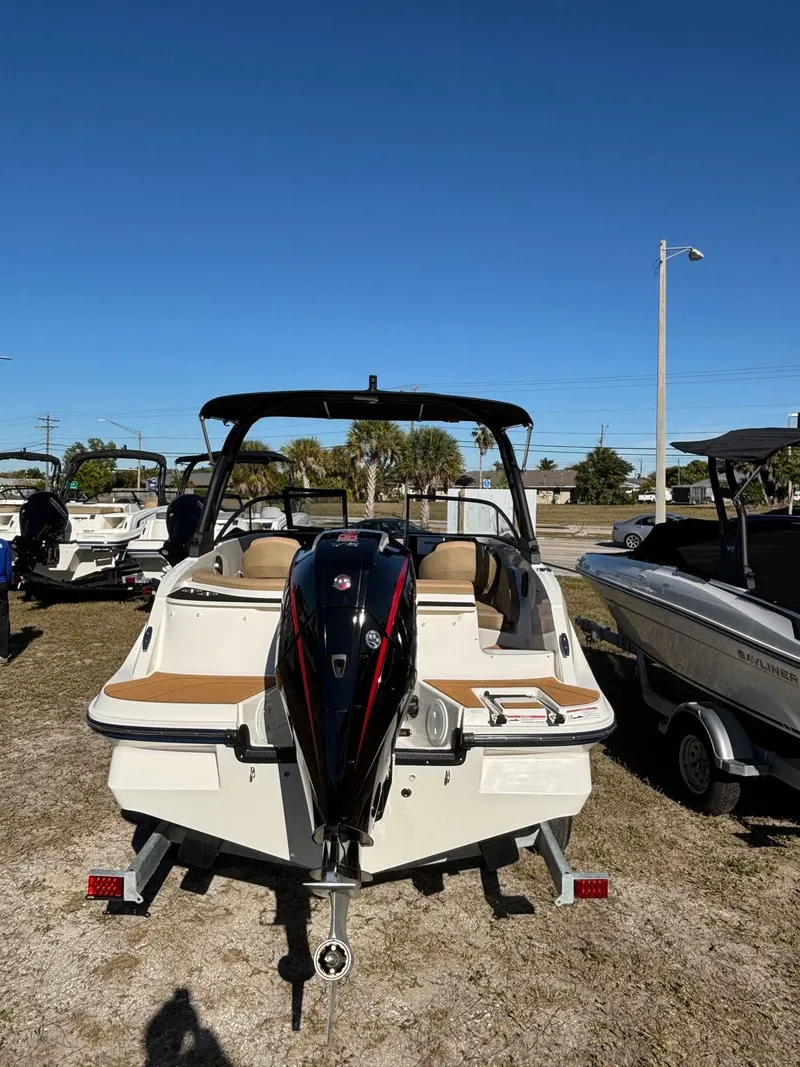 Slide: The Image of 2025 Bayliner V20 boat on a trailer outdoors. - 5