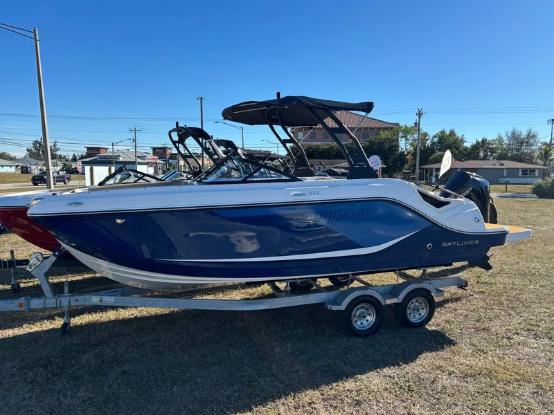 The Image of 2026 Bayliner D22 boat on trailer outdoors. - 1
