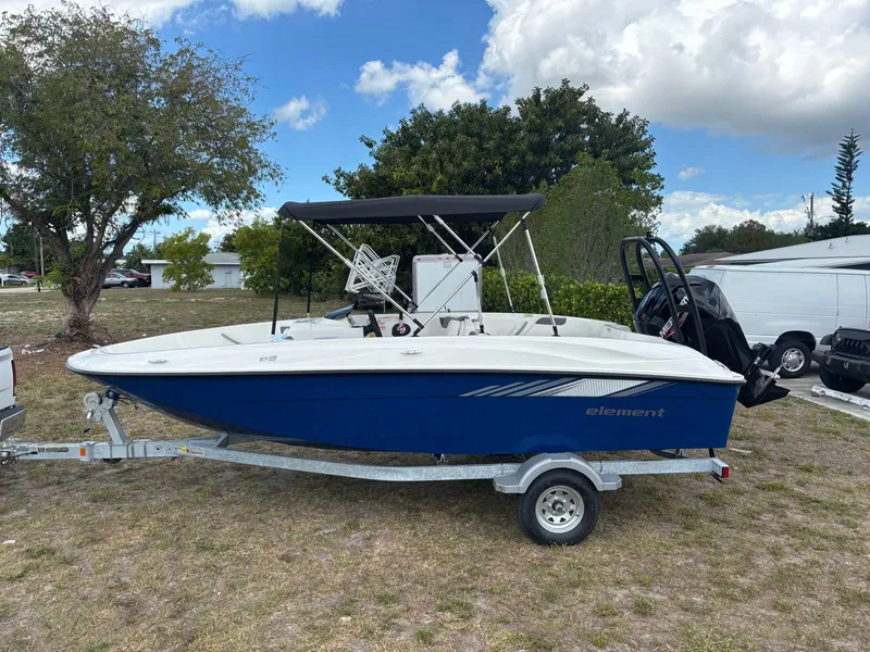 The Image of 2026 Bayliner E18LE boat parked on trailer outdoors. - 1