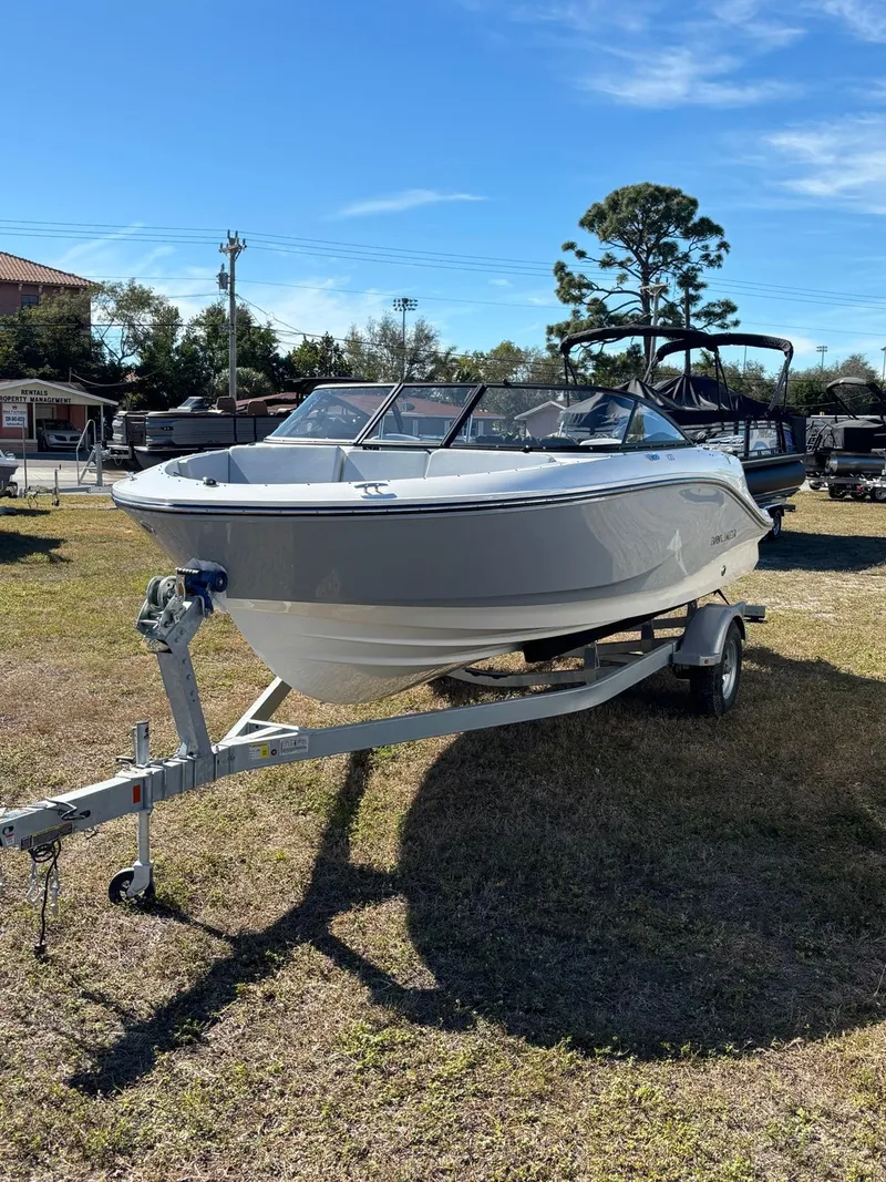 Slide: The Image of 2026 Bayliner V20 boat parked on trailer outdoors. - 11
