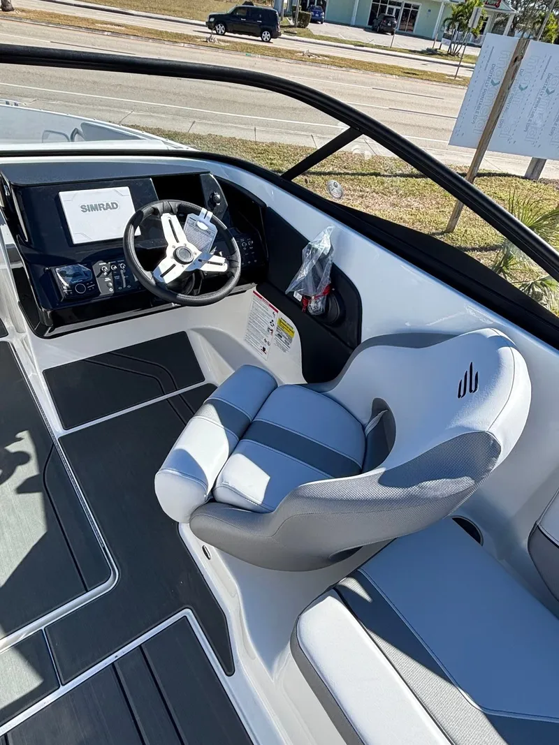 Slide: The Image of Interior of 2026 Bayliner V20 with modern helm station. - 3