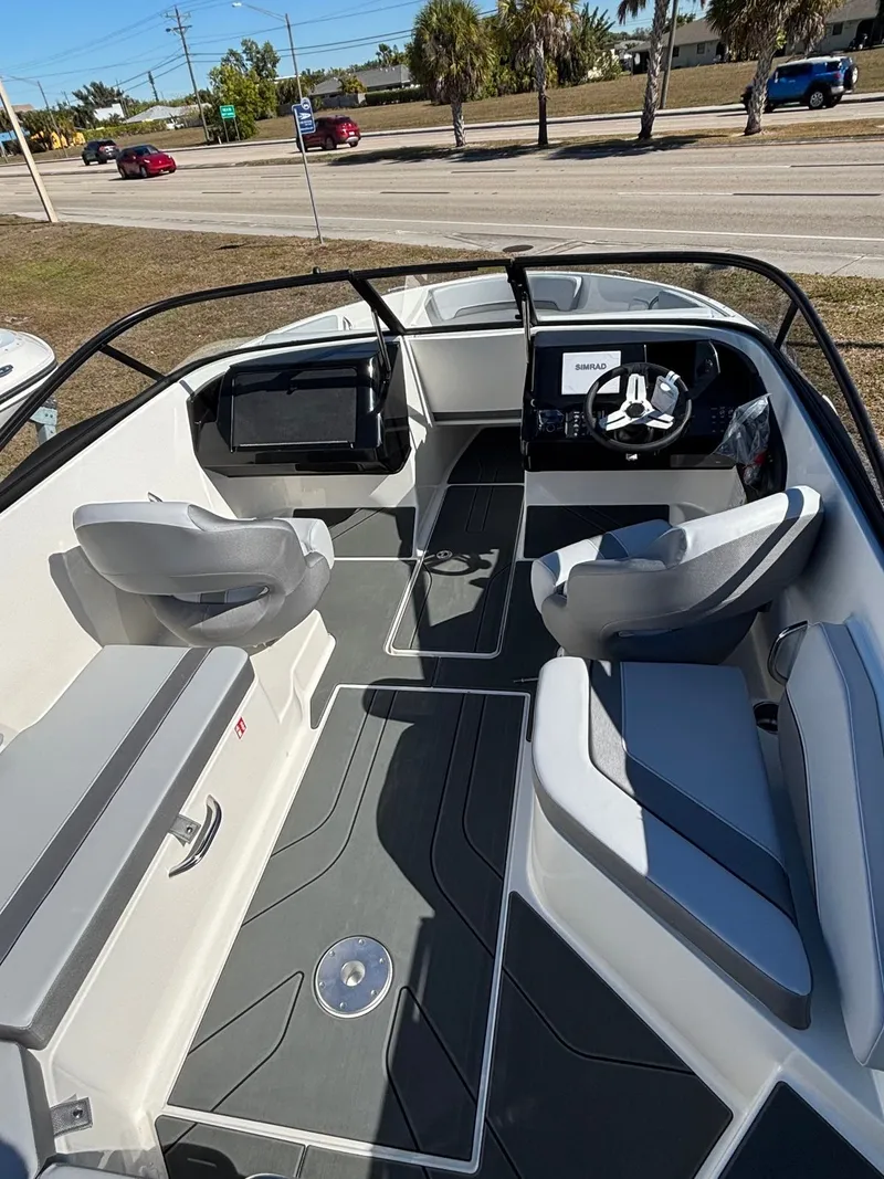Slide: The Image of Interior of 2026 Bayliner V20 with modern seating and helm console. - 5
