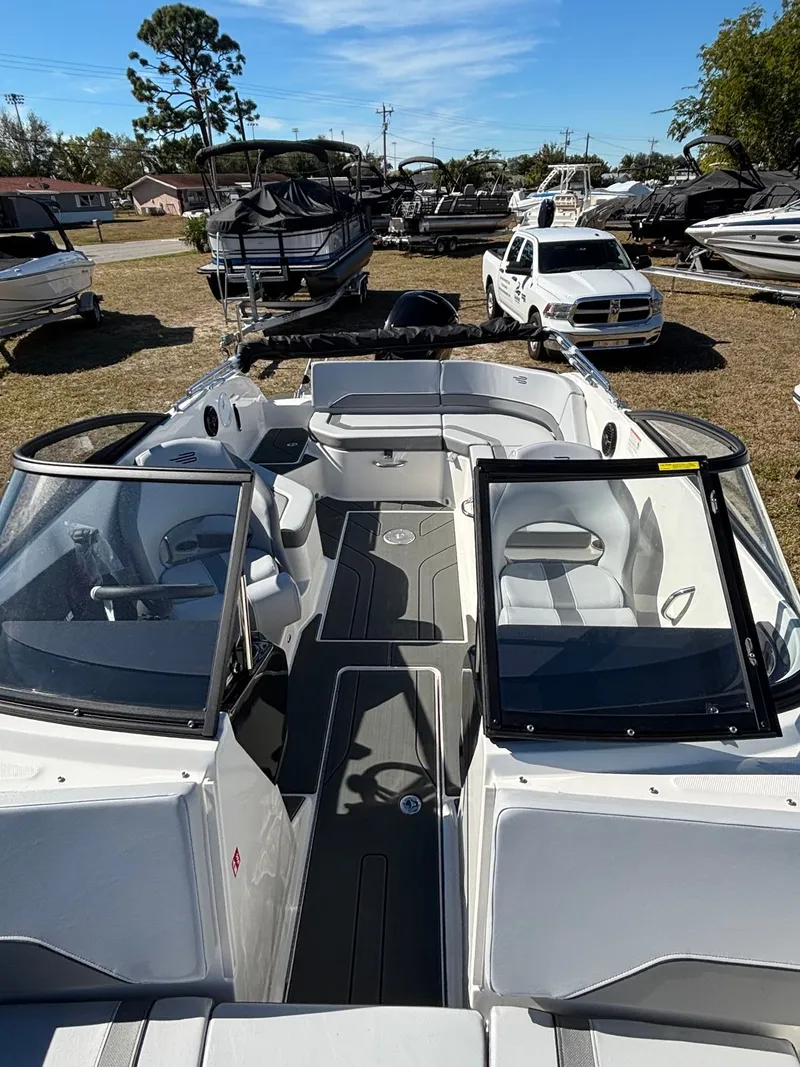 Slide: The Image of 2026 Bayliner V20 boat with open deck and modern seating. - 8