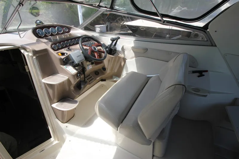 Slide: The Image of Interior cockpit of 2002 Regal Commodore 2860 boat with steering wheel and controls. - 13