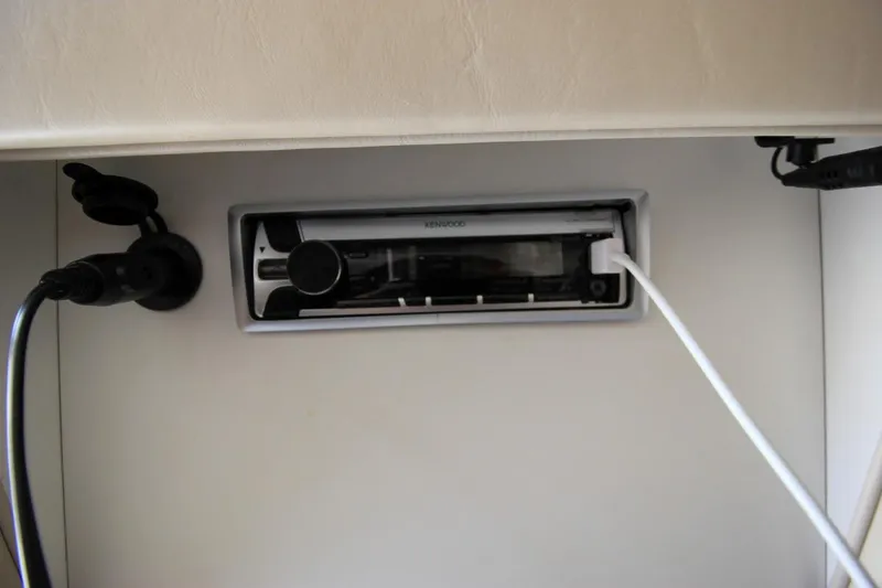 Slide: The Image of Kenwood stereo system in a 2002 Regal Commodore 2860 boat interior. - 28