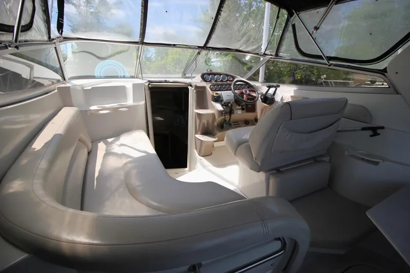 Slide: The Image of Interior of 2002 Regal Commodore 2860 boat with seating and control panel. - 7