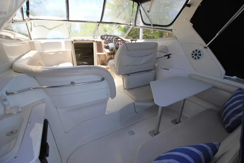 Slide: The Image of Interior of 2002 Regal Commodore 2860 boat with seating and table. - 8