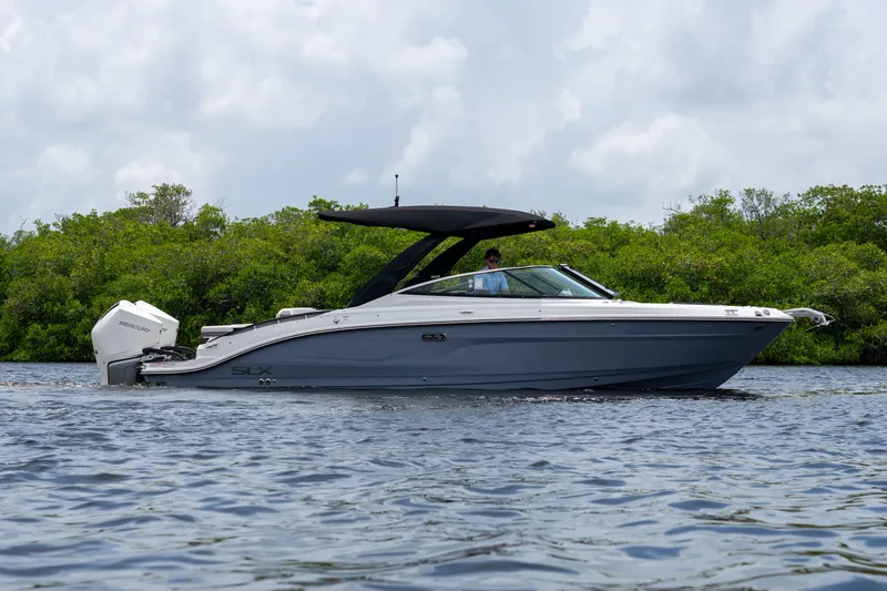 Slide: The Image of A sleek, modern motorboat on calm waters, surrounded by lush greenery. - 26
