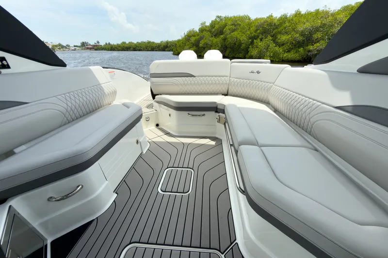 Slide: The Image of The image shows the luxurious interior of a Sea Ray SLX 280 Outboard boat with elegant seating. - 18