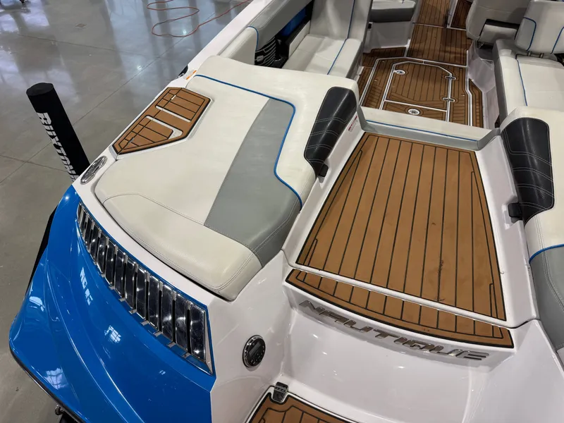 Slide: The Image of 2013 Nautique Super Air Nautique G25 interior with wooden flooring. - 13