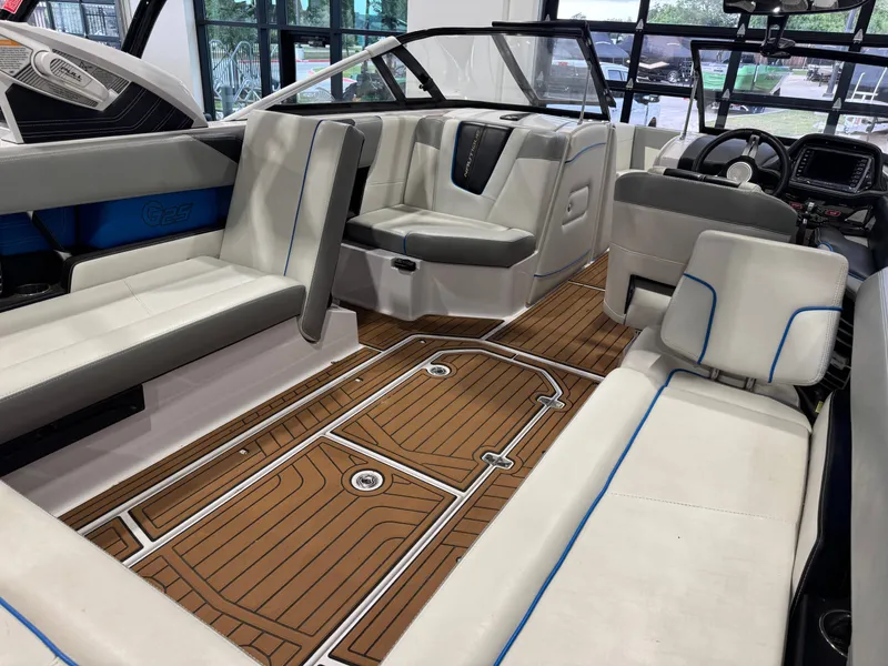 Slide: The Image of Interior of a 2013 Nautique Super Air Nautique G25 boat with luxurious seating. - 15