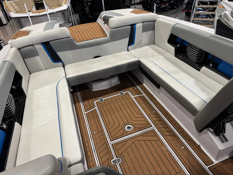 Slide: The Image of Interior of a 2013 Nautique Super Air Nautique G25 boat with seating area. - 17