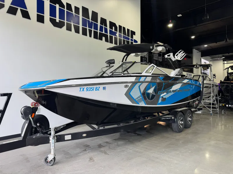 Slide: The Image of 2013 Nautique Super Air Nautique G25 boat in showroom. - 3
