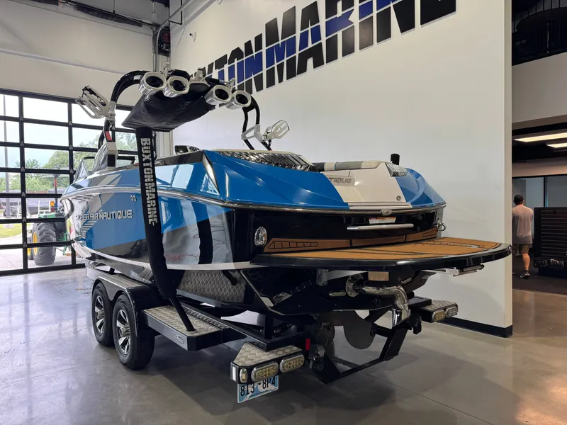 Slide: The Image of 2013 Nautique Super Air Nautique G25 boat in showroom. - 6