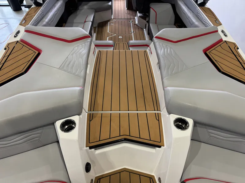 Slide: The Image of 2025 Nautique Super Air Nautique G23 interior with wood paneling. - 10
