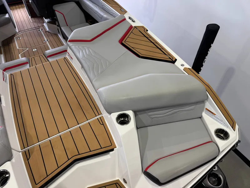 Slide: The Image of 2025 Nautique Super Air Nautique G23 interior with luxurious seating. - 11