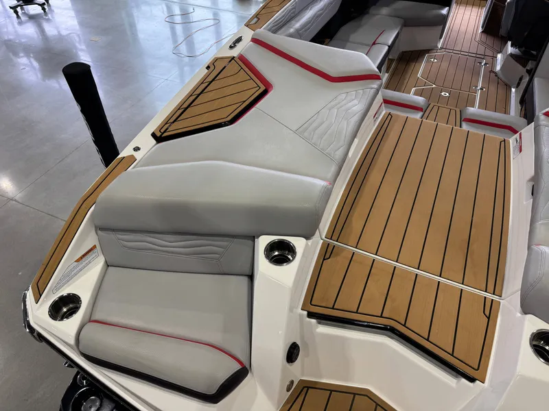 Slide: The Image of Interior of 2025 Nautique Super Air Nautique G23 with luxurious seating. - 12