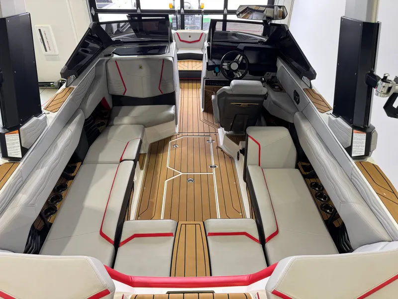 Slide: The Image of Interior of 2025 Nautique Super Air Nautique G23 with luxurious seating. - 13