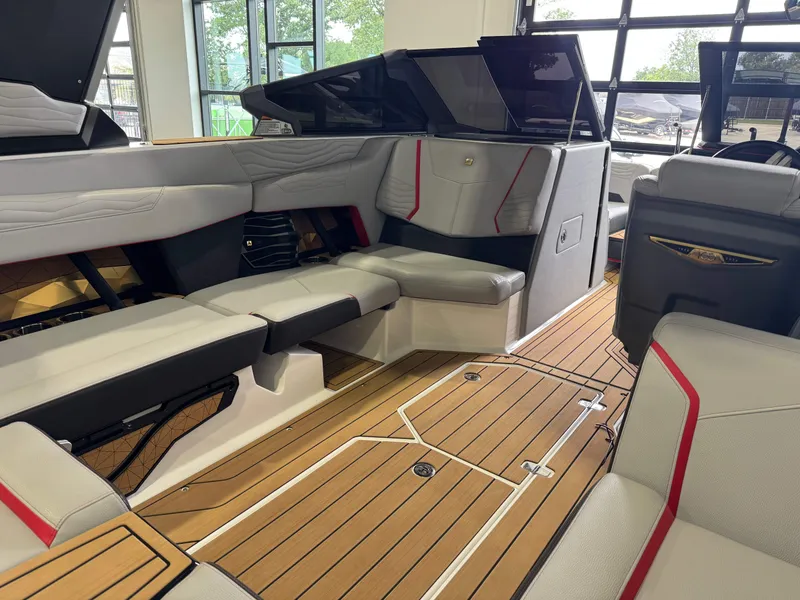 Slide: The Image of Interior of 2025 Nautique Super Air Nautique G23 with luxurious seating. - 14