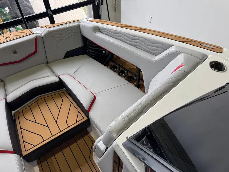 Slide: The Image of Interior of 2025 Nautique Super Air Nautique G23 with luxurious seating. - 18
