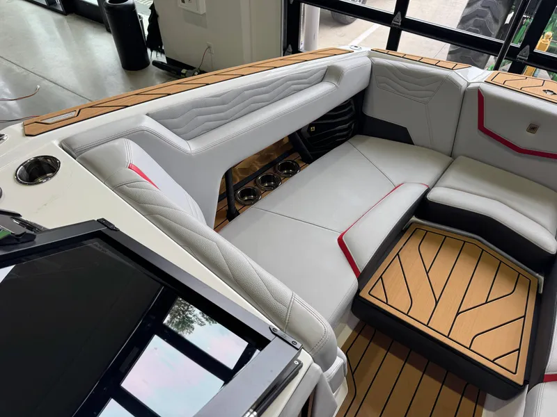 Slide: The Image of Interior of 2025 Nautique Super Air Nautique G23 with luxurious seating. - 19