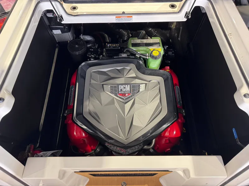 Slide: The Image of Engine compartment of 2025 Nautique Super Air Nautique G23 boat. - 28