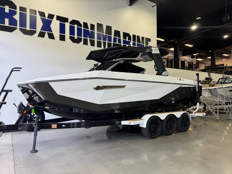 Slide: The Image of 2025 Nautique Super Air Nautique G23 boat in showroom. - 3