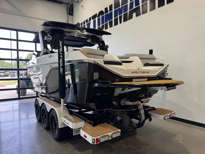 Slide: The Image of 2025 Nautique Super Air Nautique G23 boat in showroom. - 5
