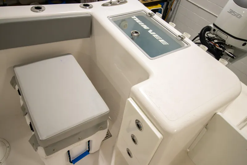 Slide: The Image of 2023 Twin Vee 340 GFX CC boat interior with seating and storage compartments. - 15