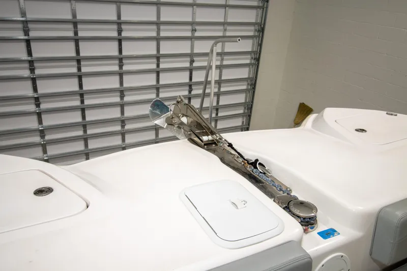 Slide: The Image of 2023 Twin Vee 340 GFX CC boat anchor system in a garage setting. - 17