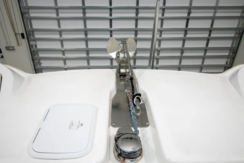 Slide: The Image of 2023 Twin Vee 340 GFX CC boat anchor system in a garage setting. - 18
