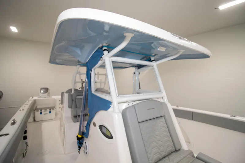 Slide: The Image of 2023 Twin Vee 340 GFX CC boat interior with seating and canopy. - 23
