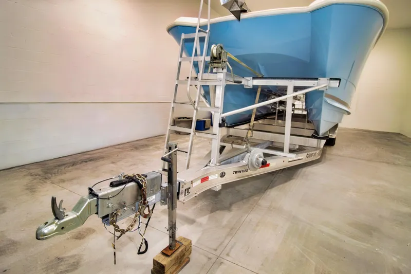 Slide: The Image of 2023 Twin Vee 340 GFX CC boat on trailer in indoor storage facility. - 3
