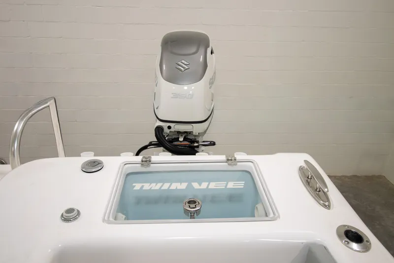 Slide: The Image of 2023 Twin Vee 340 GFX CC boat with Suzuki 350 outboard motor in a showroom. - 34
