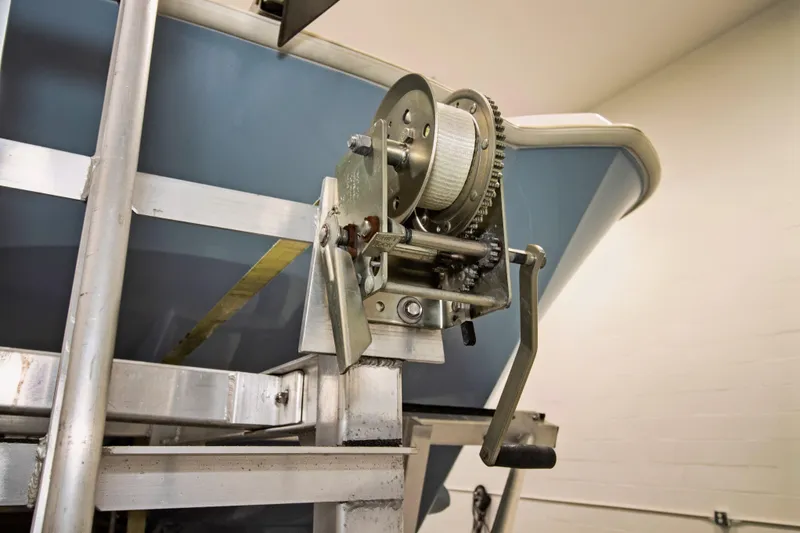 Slide: The Image of Close-up of a 2023 Twin Vee 340 GFX CC boat winch mechanism in a workshop. - 43