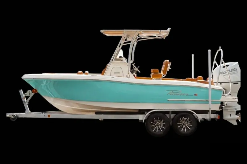 The Image of 2026 Pioneer 202 Islander boat on trailer, turquoise hull, Suzuki outboard motor. - 4