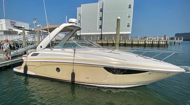 The Image of 2018 Regal 28 Express boat docked on a sunny day. - 0