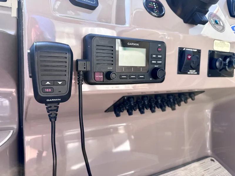 Slide: The Image of Garmin radio on 2018 Regal 28 Express boat console. - 11