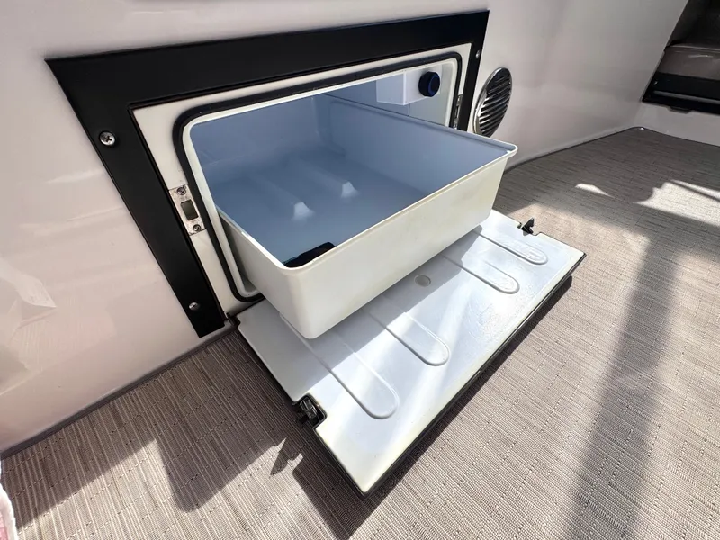 Slide: The Image of Regal 28 Express 2018 boat refrigerator with open door. - 14