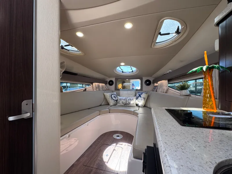 Slide: The Image of Interior of 2018 Regal 28 Express with cozy seating area. - 24