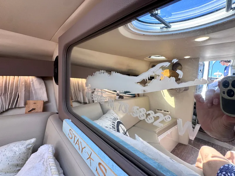 Slide: The Image of Interior of a 2018 Regal 28 Express yacht with cozy furnishings. - 26