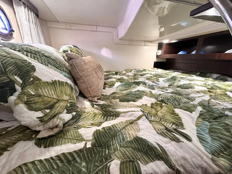 Slide: The Image of Interior of 2018 Regal 28 Express with tropical bedding. - 30