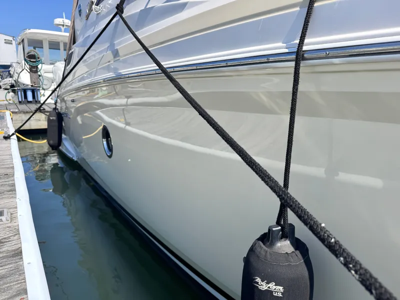 Slide: The Image of 2018 Regal 28 Express docked with fenders. - 35